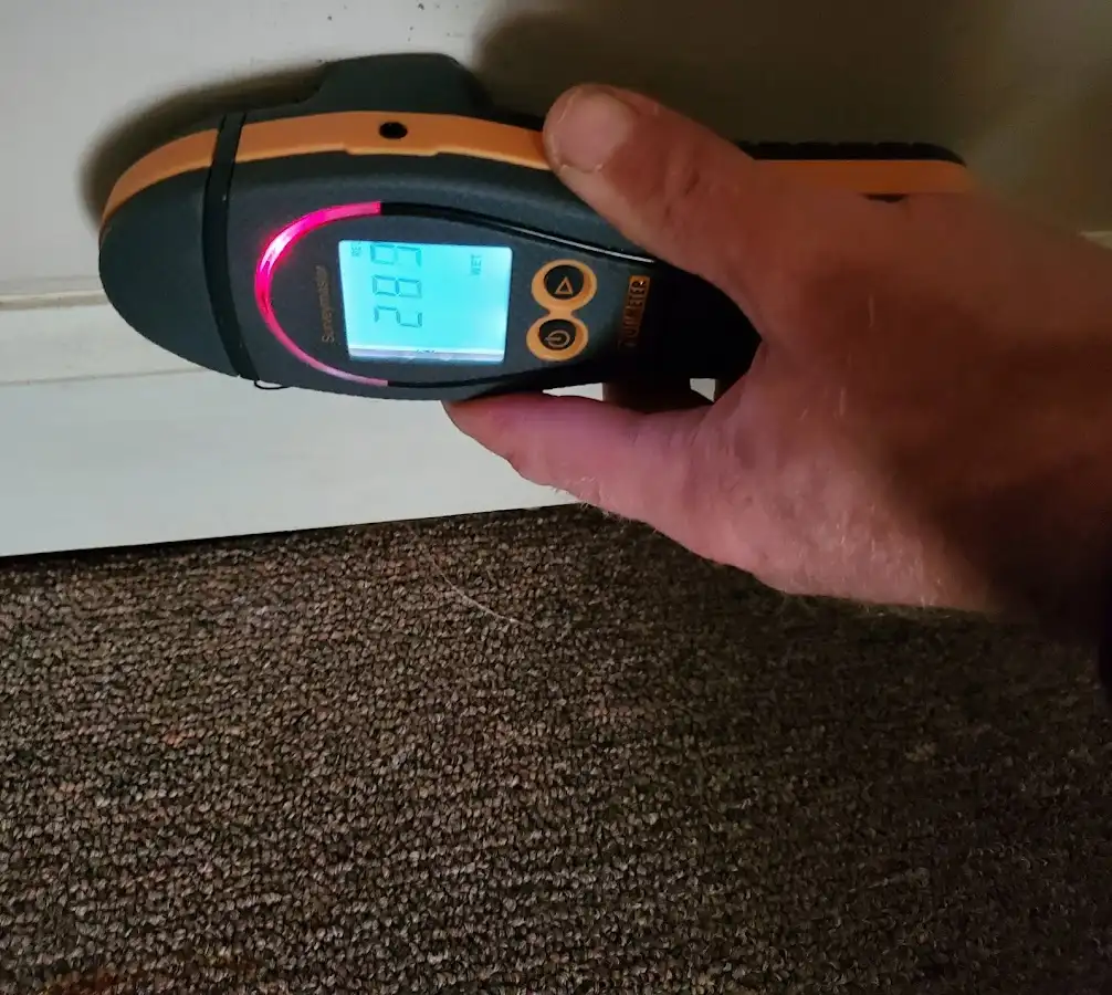 Moisture detection at baseboard during Storm Damage Restoration in Pawling